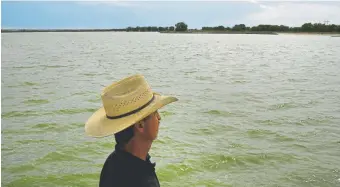  ?? Helen H. Richardson, The Denver Post ?? Farmer and cattle rancher Jim Yahn, manager of the Sterling Irrigation District and Prewitt Reservoir, looks over the full reservoir near Hillrose last week.