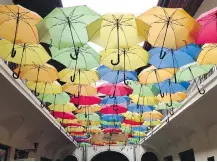  ??  ?? Colourful umbrellas are creatively suspended over an arcade in Kosice's town centre, a medieval downtown with modern touches.