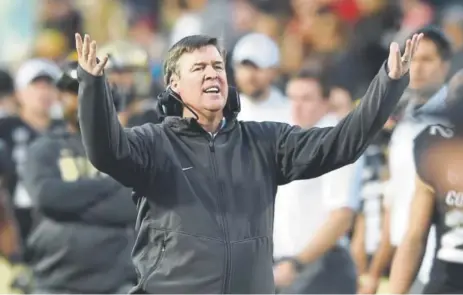  ?? Cliff Grassmick, Daily Camera ?? Mike MacIntyre, expressing frustratio­n during a game against USC on Nov. 11, has had a challengin­g season.