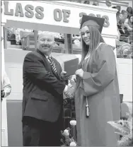  ?? MARK HUMPHREY ENTERPRISE-LEADER ?? Farmington senior Ella Wilson receives her diploma from Principal Jon Purifoy during graduation ceremonies held Tuesday, May 15 at Cardinal Arena. During her freshman year Ella’s heart stopped after checking out of a basketball game and sitting on the...