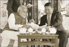  ?? PTI ?? Prime Minister Narendra Modi with Chinese President Xi Jinping in a house boat, East Lake, Wuhan, China, April 28