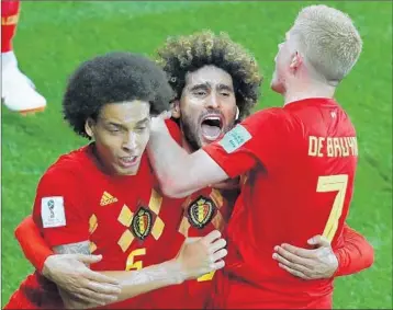  ?? JACK GUEZ/GETTY-AFP ?? Marouane Fellaini, center, celebrates with Axel Witsel, left, and Kevin De Bruyne after scoring Monday against Japan.