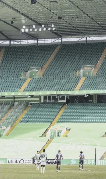  ??  ?? 0 The empty stands as Celtic played Hibs last month. Picture: Alan Harvey/ SNS