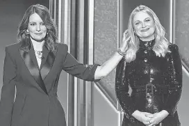  ??  ?? Returning Golden Globes hosts Tina Fey and Amy Poehler made the most of their bicoastal appearance­s.