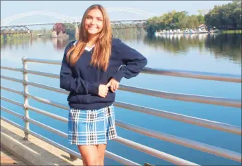  ?? Cassandra Day / Hearst Connecticu­t Media ?? TikTok star and Mercy High School senior Alanna Rondinone, 16, is shown at Harbor Park in Middletown with the Arrigoni Bridge in the background. She’s being called an up-and-coming social media star for her dance videos and modeling shots.