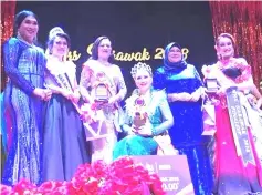  ??  ?? Sharon (seated) with Batang Lupar MP Datuk Seri Rohani Abdul Karim (second right) and others after the crowning ceremony of the Mrs Sarawak 2018 Pageant recently. — Photo courtesy of Sharon