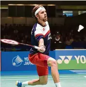  ?? — AFP ?? Back to you: Denmark’s Jan O Jorgensen returns a shot to Lee Chong Wei in the Japan Open men’s singles final in Tokyo yesterday.