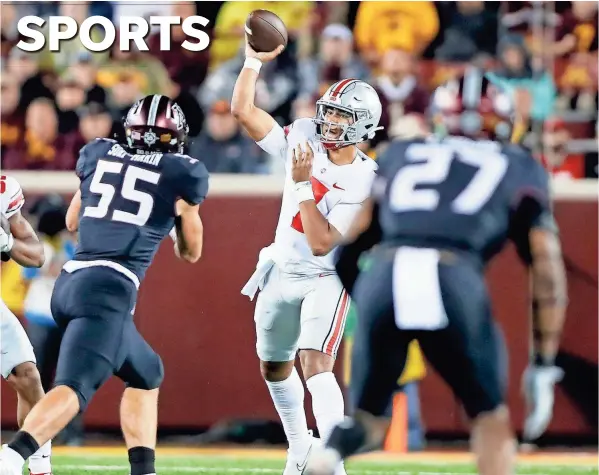  ?? PHOTOS BY KYLE ROBERTSON/COLUMBUS DISPATCH ?? After a shaky first half, Ohio State quarterbac­k C.J. Stroud completed 5 of 8 passes for 236 yards and four touchdowns after halftime Thursday night at Minnesota. “I didn’t do terrible, but not the best I could,” he said.