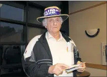  ??  ?? White Plains resident Jerry Morton Feith cites the Constituti­on as he disputes the Calvert County League of Women Voters’ policy of no campaign parapherna­lia within the nonpartisa­n event, while donning a hat with President Donald Trump’s name.