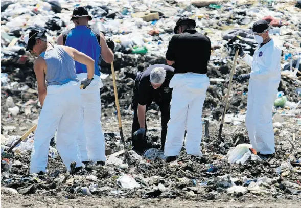  ?? GAVIN YOUNG/POSTMEDIA NEWS ?? Police search Spyhill landfill Wednesday as part of the probe in to the disappeara­nce of Nathan O’Brien and grandparen­ts.