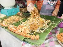  ??  ?? PAD THAI. Thailand’s famous stir-fried rice noodle dish.