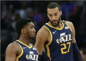  ?? DUANE BURLESON - THE ASSOCIATED PRESS ?? FILE - In this Saturday, March 7, 2020, file photo, Utah Jazz center Rudy Gobert (27) talks with guard Donovan Mitchell, left, during the second half of an NBA basketball game against the Detroit Pistons, in Detroit. Both players have tested positive for the coronaviru­s. Gobert’s test result forced the NBA to suspend the season.