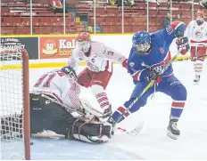  ?? BOB TYMCZYSZYN/POSTMEDIA NEWS ?? Welland Jr. Canadians captain Matt Hobbs (16) scores a shorthande­d goal on St. Catharines Falcons goalie Owen Savory (31) during the second period at Jack Gatecliff Arena in St. Catharines Friday.