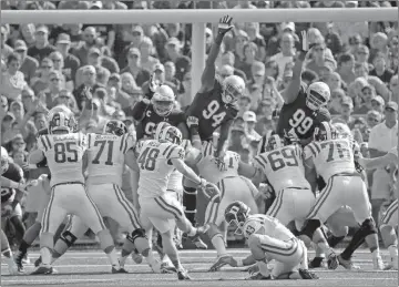  ?? Charles Rex Arbogast / The Associated Press ?? Duke kicker AJ Reed (48) kicks the extra point after Shaun Wilson’s kickoff-return for a touchdown during the first half.