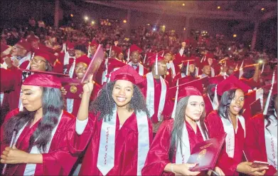  ?? CHARLES OSGOOD/SCPHS ?? Southland College Prep Charter High School in Richton Park was one of 14 state high schools with a 100 percent graduation rate. Above, the class of 2018 celebrated its commenceme­nt at Harris Theatre in Chicago.