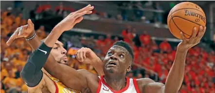  ??  ?? Houston Rockets centre Clint Capela shields the ball from Utah Jazz rival Rudy Gobert.