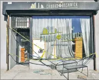  ??  ?? OUTRAGE: The Chabad of Bushwick synagogue window is still shattered Sunday, a day after vandals struck while the rabbi and his guests were having Shabbos dinner.