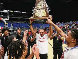  ?? Ronald Cortes / Contribuit­or ?? Hitchcock coach Christophe­r Jordan-Foster, a 2001 graduate of Hitchcock, celebrates his team’s 3A state championsh­ip at the Alamodome in San Antonio after the Bulldogs beat Childress.