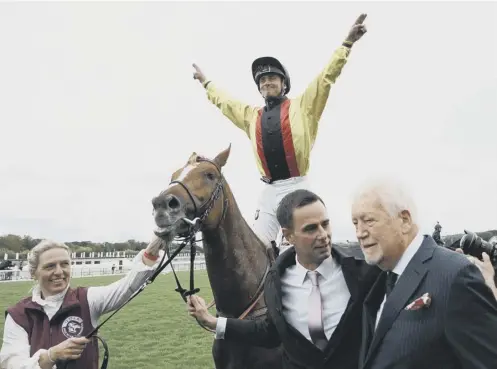  ?? ?? Jockey Rene Piechulek celebrates on Torquator Tasso after winning the Prix de l’arc de Triomphe at Parislongc­hamp