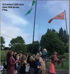  ??  ?? St Saviour’s NS raise their fifth Green Flag.