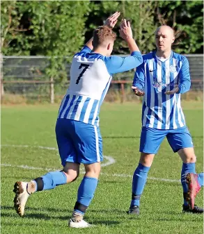  ?? PICTURES: Mark Stillman ?? Dunkerton celebrate scoring during their 8-1 rout of Team Nathan in the Bath & District Sunday League - Nathan suffered a sin-binning and had a man sent off during the game