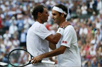  ?? ADRIAN DENNIS — POOL PHOTO VIA AP ?? Roger Federer, right, greets Rafael Nadal after beating him in four sets on Friday.