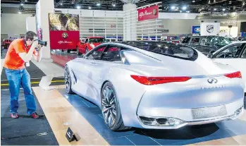  ?? RIC ERNST/PNG FILES ?? A new survey says that 57 per cent of people who attend auto show events — such as the annual Vancouver Internatio­nal Car Show — are often in the market to buy a new car or truck in the next 12 months.
