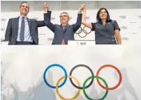  ?? JEAN-CHRISTOPHE BOTT, EPA ?? From left, Los Angeles Mayor Eric Garcetti, Internatio­nal Olympic Committee President Thomas Bach and Paris Mayor Anne Hidalgo will play key roles in the 2024 and 2028 Games.