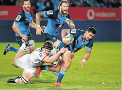  ?? Picture: Gallo Images ?? Divan Rossouw of the Bulls is tackled by Scott Barrett of the Crusaders during their Super Rugby clash at Loftus Versfeld on Friday night.