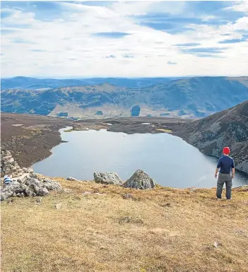  ??  ?? Loch Brandy is just one delight awaiting walkers in Glen Clova. Picture VisitScotl­and.