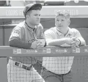  ?? David Zalubowski / Associated Press ?? Jose Altuve, left, doesn’t like the view from the bench, but he’s abiding by the wishes of trainer Nate Lucero, right, and manager A.J. Hinch.