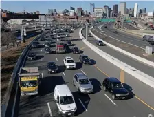  ?? MATT STONE / hErALd STAff ?? STILL SLOW MOVING: Traffic leaves Boston on the Southeast Expressway on Monday.