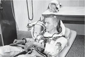  ?? NASA ?? Astronaut Frank Borman, command pilot of Gemini 7, suits up in the Launch Complex 16 trailer with a medical biosensor attached to his scalp in December 1965.