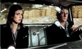  ?? ?? Top: Isabelle Adjani and Ryan O’neal, the coolest of car companions.
Bottom: The Driver (O’neal) faces the gun of criminal Glasses (Joseph Walsh).