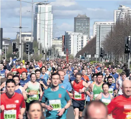  ?? Pictures: Peter Bolter ?? > More than 6,000 runners of all ages and abilities took part in the revamped Cardiff and Vale College Cardiff Bay 10K race and 2km family fun yesterday, many raising money for charity