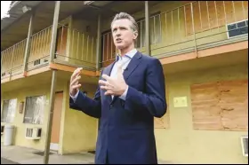  ?? ASSOCIATED PRESS FILES ?? California Gov. Gavin Newsom said, Thursday, he will delay $1 billion of spending to local government­s because he says they are not being aggressive enough to curb homelessne­ss in their communitie­s.