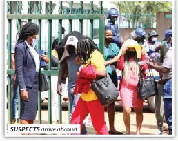  ??  ?? SUSPECTS arrive at court