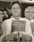  ?? AFP ?? ■ Imran Khan with his party’s manifesto
