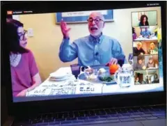  ?? AFP ?? Rabbi Jeffrey Bennett of Temple Sinai in Newington, Connecticu­t, hosts a virtual community Seder on Zoom during the first night of Passover.