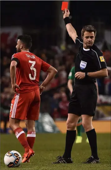  ??  ?? Neil Taylor of Wales is shown a red card by referee Nicola Rizzoli following his tackle on Seamus Coleman.