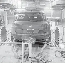  ?? Carlos Osorio / Associated Press file ?? A Volkswagen Touareg diesel is tested last year in an Environmen­tal Protection Agency facility in Ann Arbor, Mich.