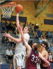  ?? AUSTIN HERTZOG - DIGITAL FIRST MEDIA ?? The Hill School’s Seth Maxwell scores on a putback against Taft Sunday. Maxwell was named Mercer Invitation­al Tournament MVP following Hill’s 60-45 win in the final.