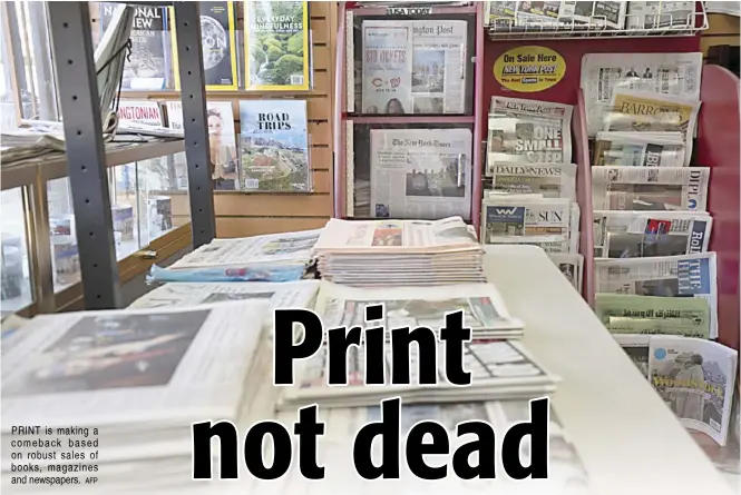  ?? AFP ?? PRINT is making a comeback based on robust sales of books, magazines and newspapers.