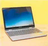  ?? SARAH TEW/TNS ?? The touchscree­n display of Samsung Chromebook Plus V2 can rotate 360 degrees into tablet mode so you can play Android games.