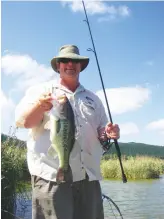  ?? Photo: Philip Weyl ?? Alien fishes such as this largemouth bass caught by the author are considered conflict species because they cause harm to native fishes but also provide social and economic benefits through angling related expenditur­e.