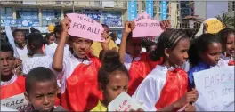  ?? The Associated Press ?? Children from a local martial arts and fitness centre hold peace signs at a street carnival organized in Tigray last year.