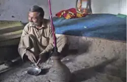  ??  ?? A Pakistani smoker putting hashish into a chillum pipe before smoking in Peshawar.