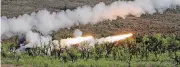  ??  ?? Soldiers with the 2nd Battalion, 4th Field Artillery participat­e in a live-fire exercise of its Multiple Launch Rocket System at Fort Sill’s West Range.