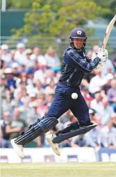  ?? Reuters ?? Scotland’s Calum MacLeod cuts one to the fence during the One Day Internatio­nal match against England at the Grange Cricket Club in Edinburgh on Sunday.