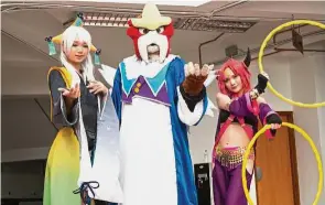  ??  ?? Cosplayers Kino Mikii, Entei Sum and Cathrys Chin as the Pokemon Jirachi, Entei and Hoopa respective­ly.